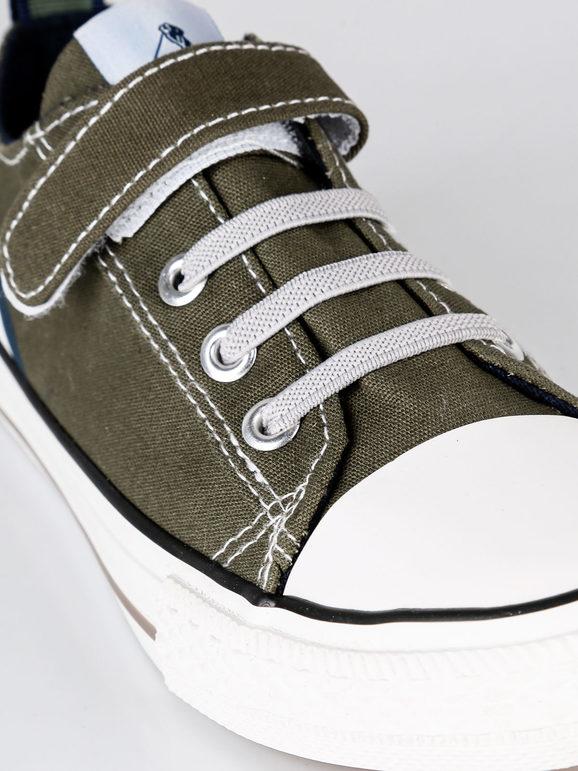 Canvas sneakers with tear