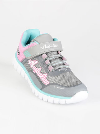 Little girl sports shoes with tear