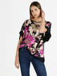 Oversized women's blouse with short sleeves