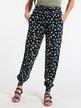 Trousers with star print and cuffs