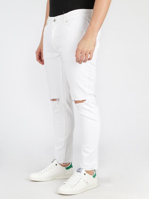 White ripped trousers