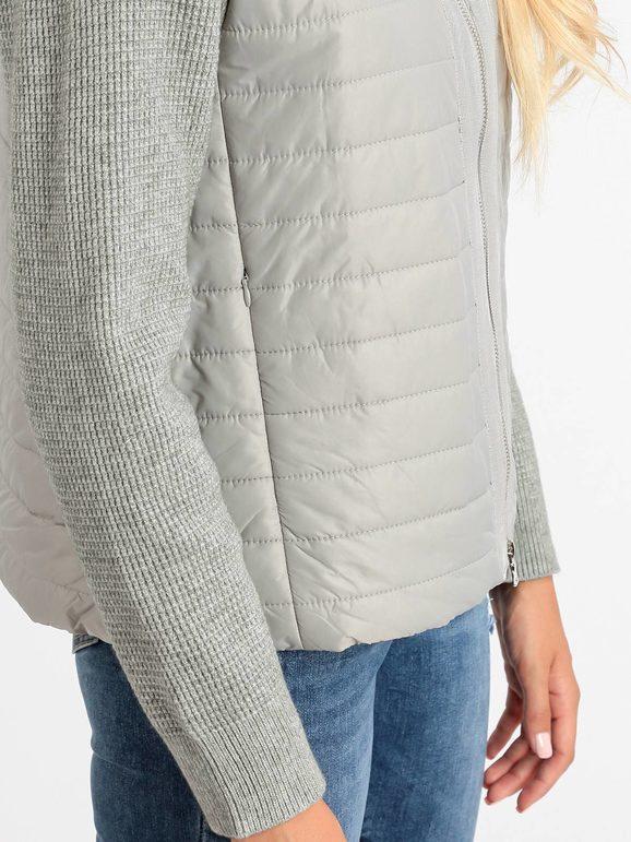 Woman jacket with knitted sleeves