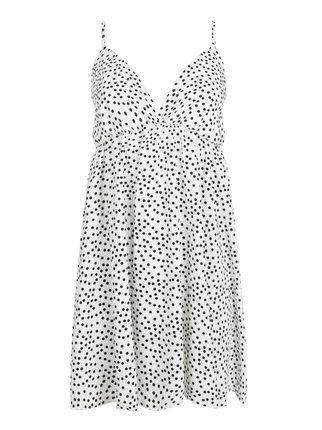 Woman polka dot dress with bow on the back