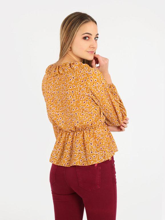 Women's blouse with deep V-neck and ruffles