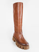 Women's leather boots with treaded sole