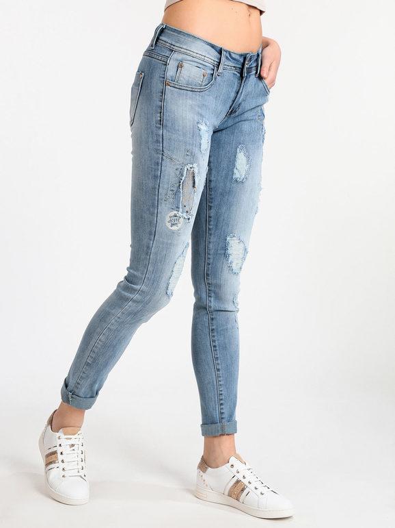 Women's ripped jeans with studs and rhinestones